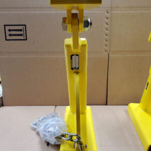 A Yellow Stand Featuring a Chain Attached, Designed for Stability and Security in Various Settings.