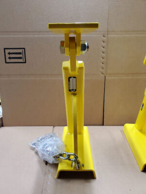 A Yellow Stand Featuring a Chain Attached, Designed for Stability and Security in Various Settings.