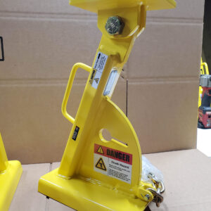Two Yellow Metal Stands Connected by a Chain, Positioned Upright Against a Neutral Background