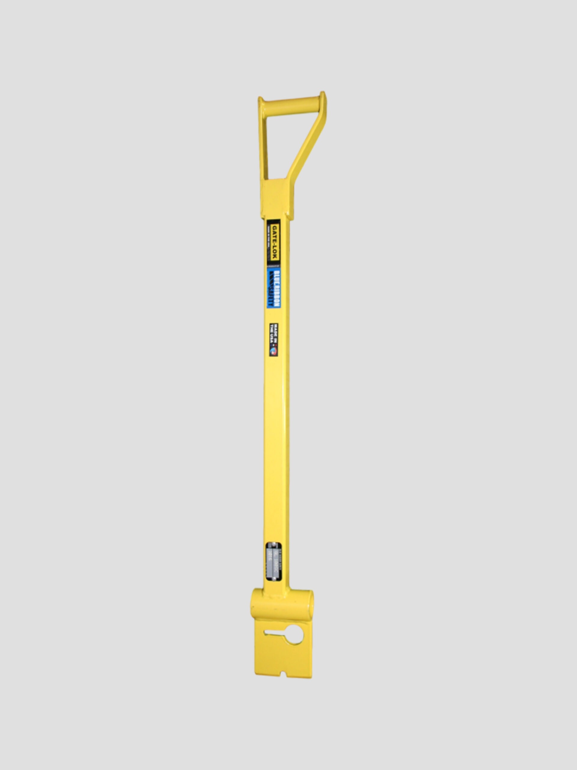 A Yellow Tool With a Handle Positioned Against a Gray Background, Showcasing Its Vibrant Color and Design.