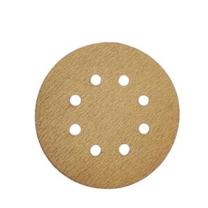 Close-up of a single velcro type sanding disc, with holes for dust collection